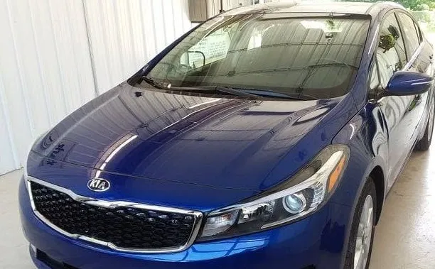 Blue Kia Forte refinished to a factory colour match at Spanky's