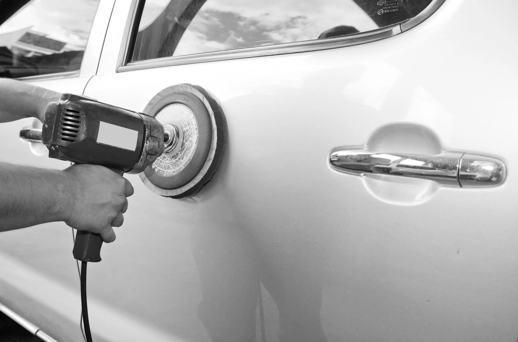 Polishing a white car panel