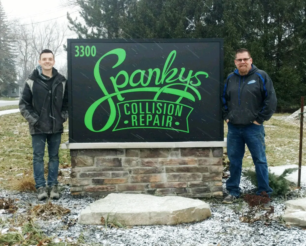 Gordy and Chris Burns outside Spanky's Collision Repair on 24th Ave in Hudsonville, MI
